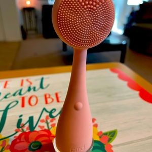 Rose gold cleansing tool.